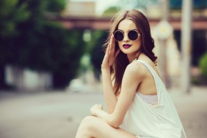 beautiful girl in sunglasses sitting